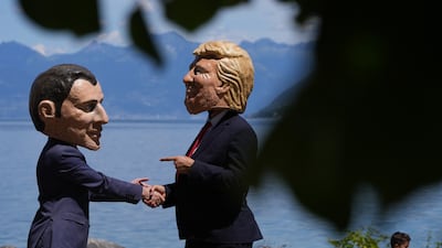 Protesters wearing masks of G7 world leaders, including French President Emmanuel Macron and US President Donald Trump during a demonstration on Sunday ahead of the G7 summit in Evian, France. Bloomberg