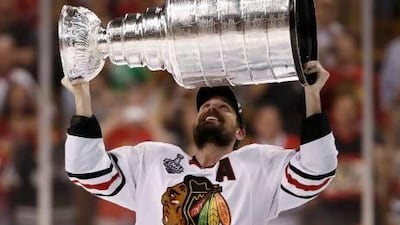 Chicago Blackhawks' Patrick Sharp celebrates with the Stanley Cup after his team defeated the Boston Bruins in Game 6 of their NHL Stanley Cup finals series at Boston.