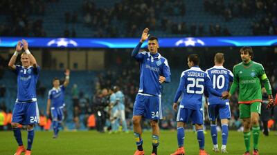 Dynamo Kiev's Ukrainian defender Yevhen Khacheridi, centre, waves to the fans following their Uefa Champions League last 16, second leg match against Manchester City at the Etihad Stadium in Manchester, north west England, on March 15, 2016. The match ended in a draw. AFP / PAUL ELLIS