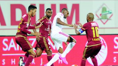 Home side Sharjah, in white, were unable to score against Al Wahda , ending up losing their Arabian Gulf Cup fixture 2-0. Al Ittihad