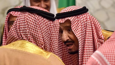 Saudi King Salman bin Abdulaziz chats with King Hamad bin Isa Al-Khalifa of Bahrain. AFP / Fayez Nureldine