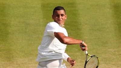 Australia's Nick Kyrgios returns to Rafael Nadal during their singles fourth round match on Day 8 of the 2014 Wimbledon Championships at the All England Club in London, England on Tuesday. Andrew Yates / AFP
