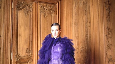 A lace dress with tulle cape