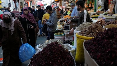 While some Gazans wear face masks as they go about their shopping, the authorities have not announced coronavirus restrictions this Ramadan. AP Photo