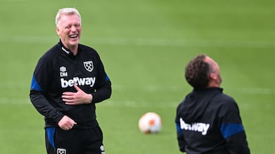 West Ham manager David Moyes enjoys a joke during training. AFP