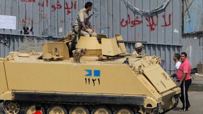 Military vehicles sealed off traffic in a wide area around the Rabaa Adawia mosque where Morsi supporters led by senior Brotherhood leaders have been staging protests since his ouster. Amr Nabil / AP Photo