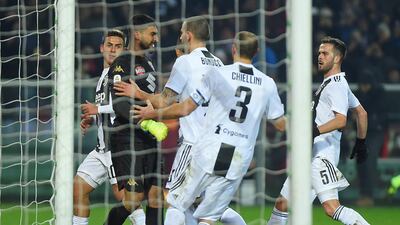 Leonardo Bonucci speaks with with Torino's Salvador Ichazo after Cristiano Ronaldo scores their first goal from the penalty spot. Reuters