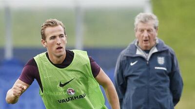 England manager Roy Hodgson, far, watches Harry Kane on Wednesday during a training session at St George's Park. Carl Recine / Action Images / Reuters