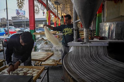 Bakers in Cairo prepare traditional sweets. AFP