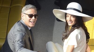 George Clooney and his wife Amal Alamuddin leave city hall after their civil marriage ceremony in Venice on September 29, 2014. Luigi Costantini / AP Photo