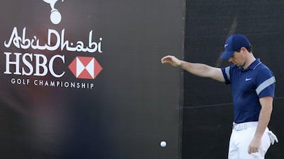 Rory McIlroy of Northern Ireland plays with a ball during the final of the Abu Dhabi Golf Championship in the capital of the United Arab Emirates on January 24, 2016. / AFP / KARIM SAHIB