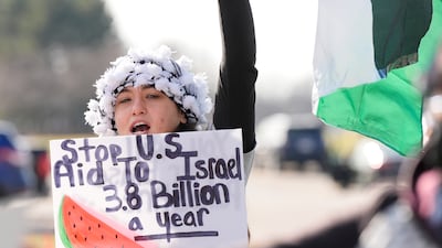 Protesters gather outside The Henry hotel hoping to be heard by members of the White House delegation who met Muslim and Arab-American leaders in Dearborn, Michigan. AP