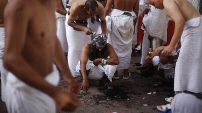 A pilgrim has his head shaved in Mina, near Mecca, following yesterday’s stoning ritual. Some men will only trim their hair, as will women. Afterwards, the pilgrims travel to Masjid Al Haram, the Sacred Mosque in Mecca, to circle the holy Kaaba seven times. Ibraheem Abu Mustafa / Reuters