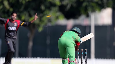 UAE's Qadeer Ahmed bowled Zimbabwe's Chamu Chibhabha to take the first of his two wickets on Thursday. Chris Whiteoak / The National