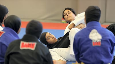 Rosalind Ferreira, centre, one of the trainers of the UAE national team, has called the growth of the sport among Emirati women and girls "remarkable". Pawan Singh / The National