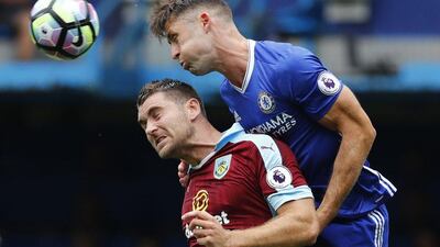 Burnley forward Sam Vokes is challenged by Chelsea defender Gary Cahill. Eddie Keogh / Reuters