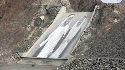 It took the German artist Case Maclaim two weeks to paint the Sheikh Zayed artwork on the inclined wall of dam. Chris Whiteoak / The National