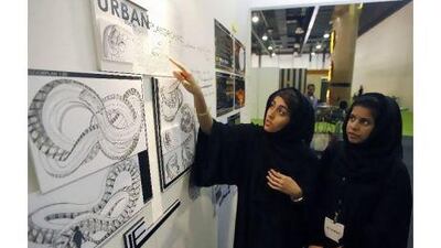 Azza al Shamsi, left, and Afnan Saeed from Zayed University explain their urban playground design at the Interior Design Show 2010 in Dubai.