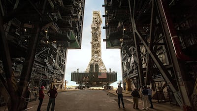 NASA employees look on as the Artemis launch tower rolls back from Pad 39B inside Bay 3 of the Vehicle Assembly Building (VAB) at the Kennedy Space Center in preparation for the landfall of Hurricane Dorian, in Cape Canaveral, Florida, US. Reuters