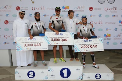 Mubarak Al Ajji, second left, had a podium finish in the national championship section of the triathlon on March 16.