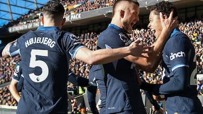 Tottenham's Brennan Johnson, right, celebrates with teammates after scoring his side's opening goal. AP