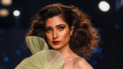 The Ashish N Soni, Gauri & Nainika Karan trio also created floral ruffles with sparkly centres in a soothing colour palette. Chandan Khanna / EPA