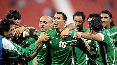 Younus Mahmood, centre, is congratulated after Iraq score in injury time.