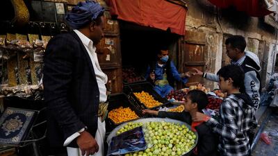 File photo: Market traders wear masks in Sanaa. Yemen's Houthi rebels have been accused of threatening medical workers against revealing information about infection rates. EPA