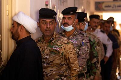 Members of Iraq's security forces take part in early voting for the parliamentary elections in Basra, on October 8, 2021. AFP