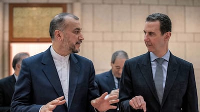Syria's President Bashar Al Assad (R) with Iran's Foreign Minister Hossein Amir Abdollahian (left) in Damascus. AFP