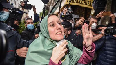 Italian aid worker, Silvia Romano reacts upon her arrival at home in Milan, Italy. EPA