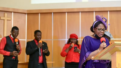 Yemi Alade leads a hymn during mass.
