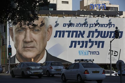 Pedestrians pass a billboard election poster for Benny Gantz, leader of the Blue and White party, in Tel Aviv, Israel. Bloomberg