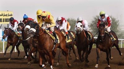Terrific Challenge ridden by Richard Mullen (yellow and red cap) comes home to win the Jebel Ali Sprint Prep at the Jebel Ali racecourse. Stephen Lock / The National