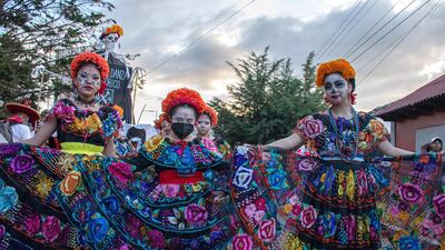 A group of indigenous women dressed as Catrinas parade in the city of San Cristobal de las Casas in Mexico. Hundreds of people dressed as skulls, ghosts and monsters paraded through the main streets of San Cristobal de Las Casas, to celebrate the mix of the traditional Day of the Dead of Mexico with Halloween of the United States. EPA