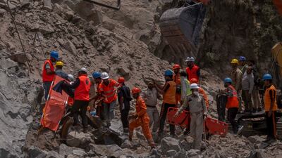 Rescue workers prepare to retrieve the body of a victim at the site of a collapsed tunnel in Ramban district, Indian-controlled Kashmir. All photos: AP