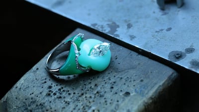 A ring with a diamond set into an opal, and inlaid into a chrysoprase. Courtesy Boghossian