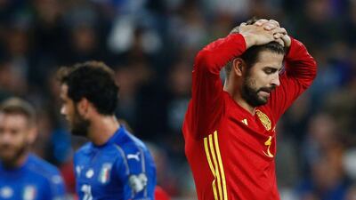 Spain defender Gerard Pique reacts during the World Cup qualifier against Italy last week. Marco Bertorello / AFP / October 6, 2016