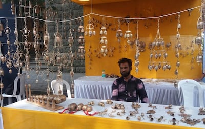 Bhuj metalworker Ramzan Lohar at an exhibition with his modern bells and wind chimes. Photo: Ramzan Lohar
