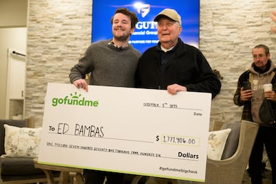Influencer Samuel Weidenhofer, left, with Ed Bambas, 88, and a cheque for $1.7 million. AP