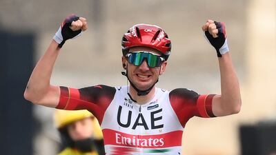 UAE Team Emirates US rider Brandon McNulty celebrates as he crosses the finish line to win the 5th stage of the 80th Paris - Nice cycling race, 189 km between Saint-Just-Saint-Rambert and Saint-Sauveur-de-Montagut, on March 10, 2022. (Photo by FRANCK FIFE / AFP)