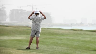 Windy weather at Yas Links Golf Club. Khushnum Bhandari for The National