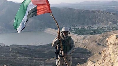 A member of the UAE military with a UAE flag at Marib Dam on Tuesday 29 September. The dam was captured from Houthi rebels on Monday 28 September. Photo courtesy of Yemeni military