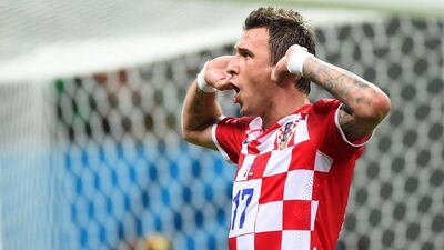 Mario Mandzukic reacts after scoring one of his two goals against Cameroon on Wednesday in their 4-0 World Cup 2014 Group A victory at the Arena Amazonia in Manaus, Brazil. Raphael Alves / AFP / June 18, 2014