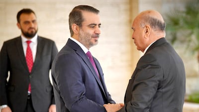 Syria's Foreign Minister Asaad Shaibani and his Iraqi counterpart Fuad Hussein meet at Tishrin Palace in Damascus. Sana
