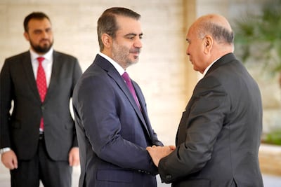 Syria's Foreign Minister Asaad Shaibani and his Iraqi counterpart Fuad Hussein meet at Tishreen Palace in Damascus. Sana
