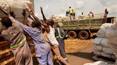 Workers load material onto a military truck in Juba after a cargo plane loaded with 300 tents and 3200 military uniforms arrived today from Cairo as a contribution towards the cantonment plans of South Sudan’s military and opposition forces. AFP