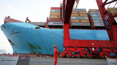 A worker is seen next to the Maersk Majestic. The ship was the biggest in the world when first launched. Aly Song / Reuters