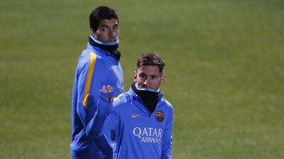 Barcelona’s Lionel Messi and Luis Suarez shown at training in Japan on Monday. Toru Hanai / Reuters