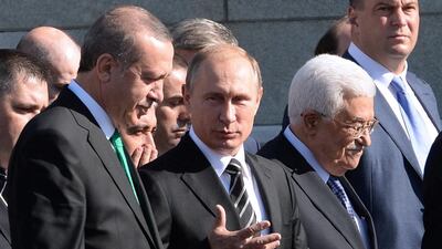Turkish president Recep Tayyip Erdogan, Russian president Vladimir Putin and Palestinian leader Mahmud Abbas arrive for the opening ceremony of the Moscow Grand Mosque in Moscow. Vasily Maximov / AFP Photo